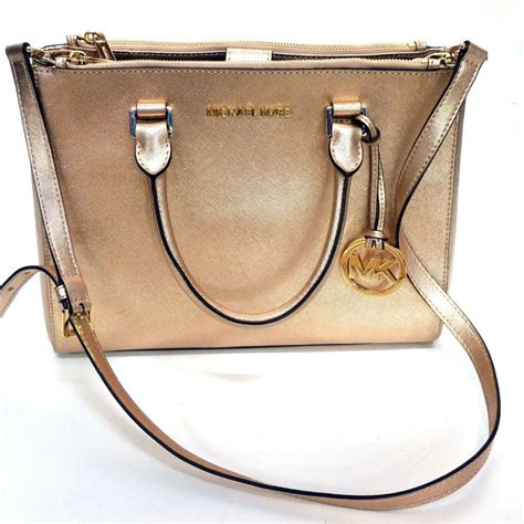 michael kors selma gold small cross body bag|Michael Kors selma satchel.